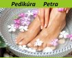 Spa treatment and product for female feet and foot spa. Foot bath in bowl with tropical flowers, Thailand. Healthy Concept. Beautiful female feet, legs at spa salon on pedicure procedure.